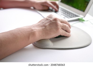 Man's fingers clicking on mouse, resting his wrist on wrist rest.  Close up shot. - Shutterstock ID 2048768363