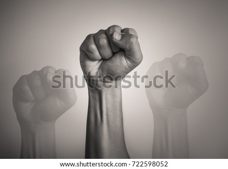 Man's fist in the air.  Revolution, protest, people, power, worker strike, election movement. Fight for your right!