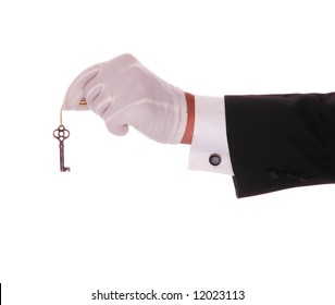 Mans Gloved Hand And Arm With Old Skeleton Key On Gold String