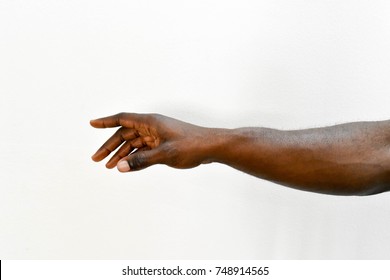 Man's Hand. African Right Hand Dark Skin Arm Reaching On Isolated White Background 