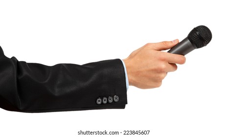 Man's Hand In Black Suit Holding A Microphone Isolated On White Background