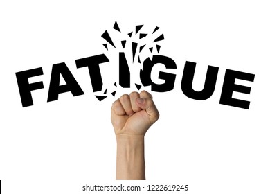 Man's hand clenched into a fist breaks the text FATIGUE on a white background. The concept of dealing with fatigue, call to work, training