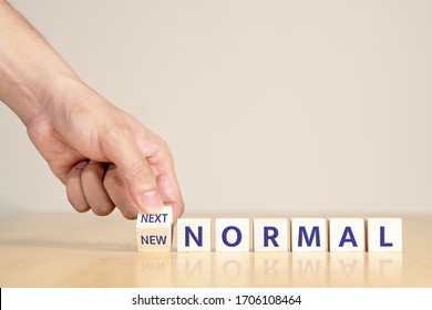 Man's hand with concept of new or next normal digital transform in industry business, disrupt from coronavirus, covid crisis impact to small business or SME. Turn to next normal in financial concept. - Shutterstock ID 1706108464