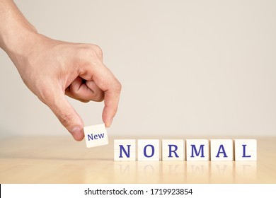 Man's Hand With Concept Of New Or Next Normal Digital Transform In Industry Business, Disrupt From Coronavirus, Covid Crisis Impact To Small Business Or SME. Turn To Next Normal In Financial Concept.