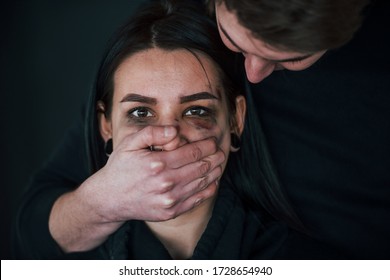 Man's Hand Covering Her Mouth. Kidnapped Woman Is Threatened By Guy.