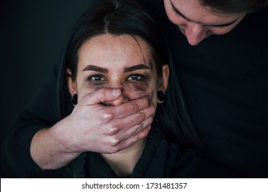 Man's Hand Covering Her Mouth. Kidnapped Woman Is Threatened By Guy.