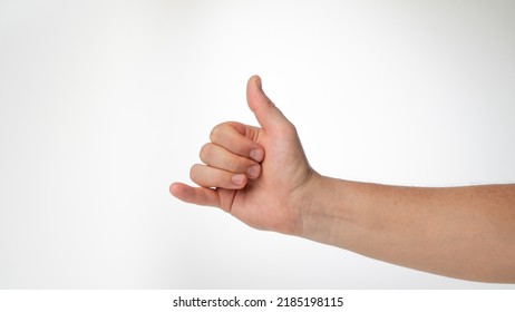 man's hand gesture greeting surfers shaka thumb and little finger protruded - Shutterstock ID 2185198115