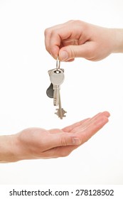 Man's Hand Giving A Bunch Of Keys, White Background