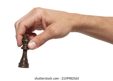 Man's hand holding a chess piece on a white background, isolated - Shutterstock ID 2159982563