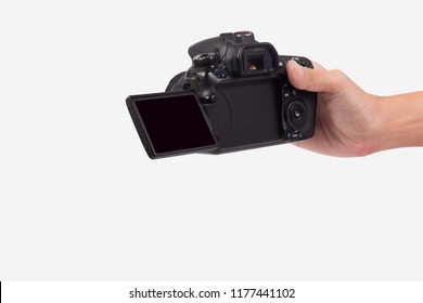 
Man's Hand Holding A DSLR Camera Isolated On White Background.