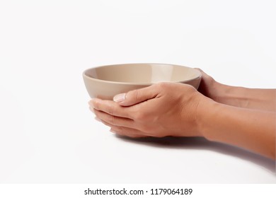 Man's hand holding empty bowl for noodles isolated on white background. Concept  wait for some food or service to others.Is taking food for someone .