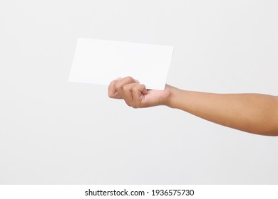 Man's Hand Holding Envelope Isolated On White Background. Close Up