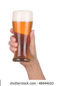 Man's Hand Holding Up A Glass Of Foamy Beer Over A White Background