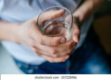 Man's Hand Holding Glass With Water