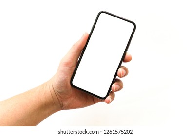 Man's Hand Holding New Model of Smartphone with Blank Screen on White Background - Shutterstock ID 1261575202