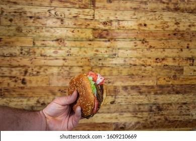 Man's Hand, Holding Onto A Burger