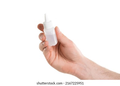 Man's Hand Holding A White Bottle Of Glue Isolated On White Background