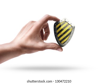 Man's Hand Holding Yellow And Black Shield Isolated On White Background