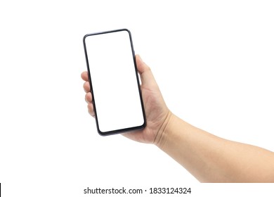 A man's hand holds a blank smartphone with a black frame. - Shutterstock ID 1833124324