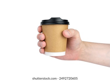 Man's hand holds a craft disposable paper cup with fresh coffee isolated on a white background.