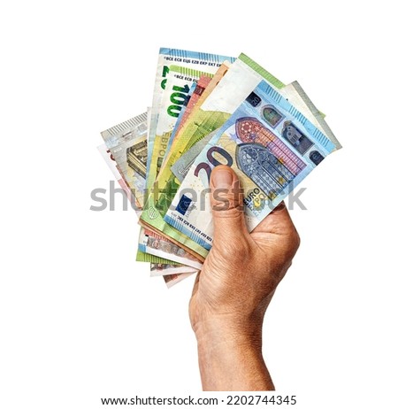 Man's hand holds euro money isolated on white background. Business concept