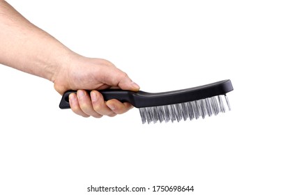 A man's hand with metal wire brush isolated. A hand holding a wire brush.Tools fof welding. Wire brush for cleaning. - Powered by Shutterstock