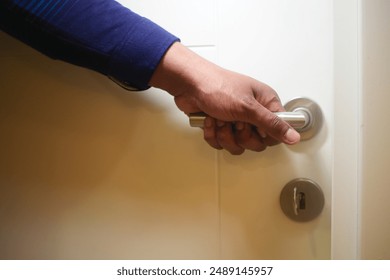 Man's Hand Opening door close up  - Powered by Shutterstock