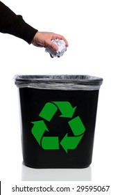 Man's Hand Placing Paper In Trash Can With Recycle Symbol