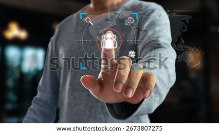 A man's hand points at a digital interface, targeting a people icon inside a crosshair. This represents customer targeting, global business strategy, and data analysis for marketing.