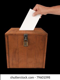 A Man's Hand Putting An Envelope In The Slot Of A Box