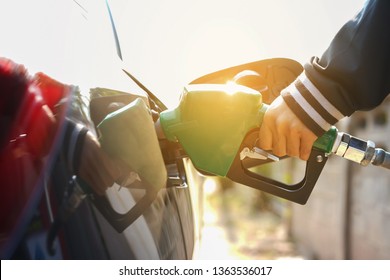 man's hand is refuelling gas or oil in the refuelling station prepare transport  to travel - Shutterstock ID 1363536017