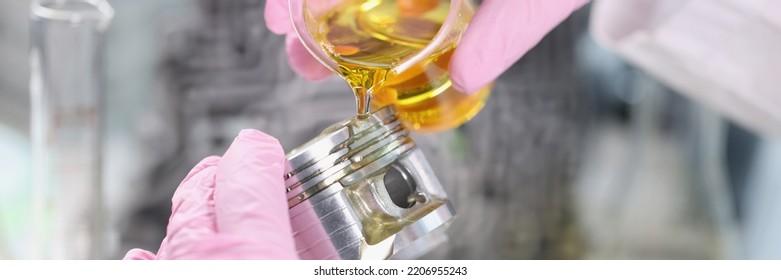 Mans Hand In Rubber Gloves Holding Car Part And Pours Lubricating Oil On It