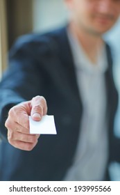 Man's Hand Showing Business Card