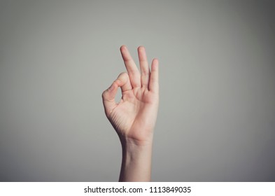 Man's Hand Showing An Okay Sign