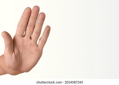 Man's hand with stop gesture on white background - Shutterstock ID 2014587245