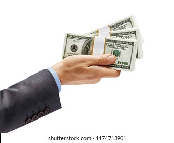 Man's Hand In Suit Giving Bundles Of Money Isolated On White Background. High Resolution Product. Close Up