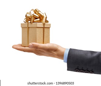 Man's Hand In A Suit Holds Gift Box Isolated On White Background. High Resolution Product