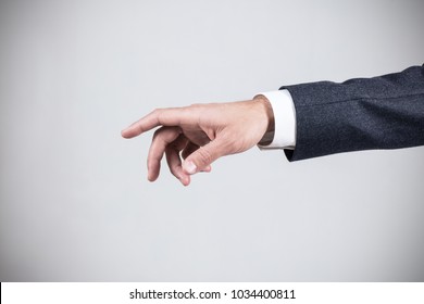 Man's Hand In Suit Pointing In The Air.