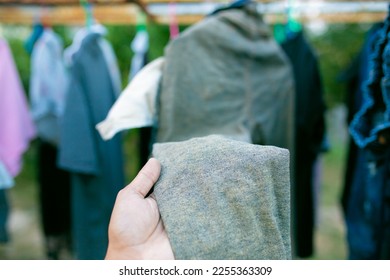 Man's hand touching denim fabric. Blue jeans. - Shutterstock ID 2255363309