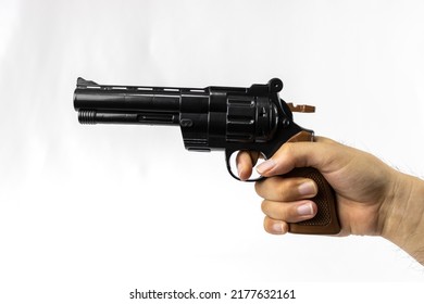 A Man's Hand With A Toy Gun (Japanese, 30s, No Face)