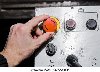 A Man's Hand Turns The Red Button On An Old Industrial Equipment Control System.