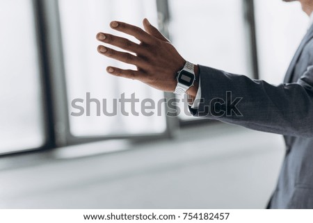 Similar – Image, Stock Photo Woman calling on phone wearing blue dress and silver wristwatch