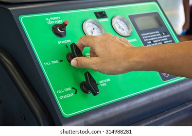 Man's Hand Working With Nitrogen Tire Filling System Machine.