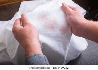 Man's Handing Hold Clothes With A Stain From Wine.top View