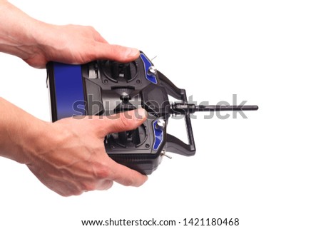 mans hands holding remote control with joysticks and antenna  isolated on white background - image 