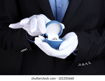 Man's Hands Holding Ring In Box