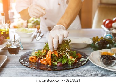 Man's Hands Make Salad. Salad With Pieces Of Fish. Recipe Of Salad With Salmon. Sliced Grape And Fish Meat.