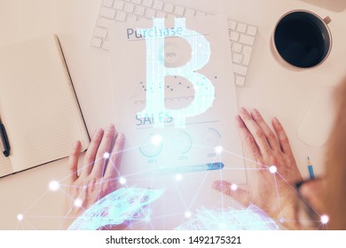 Man's hands working with notes background. Cryptocurrency and finance concept.