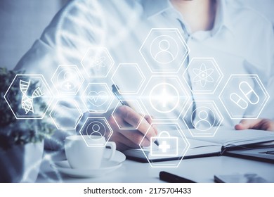 Man's hands working with notes background. Genetic engineering and gene manipulation concept. Double exposure.