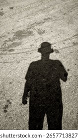 man's shadow under the light 